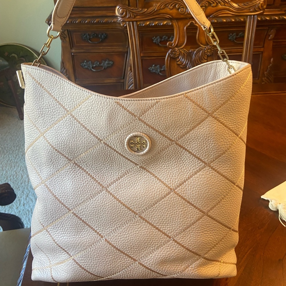 Tory Burch pale pink handbag.